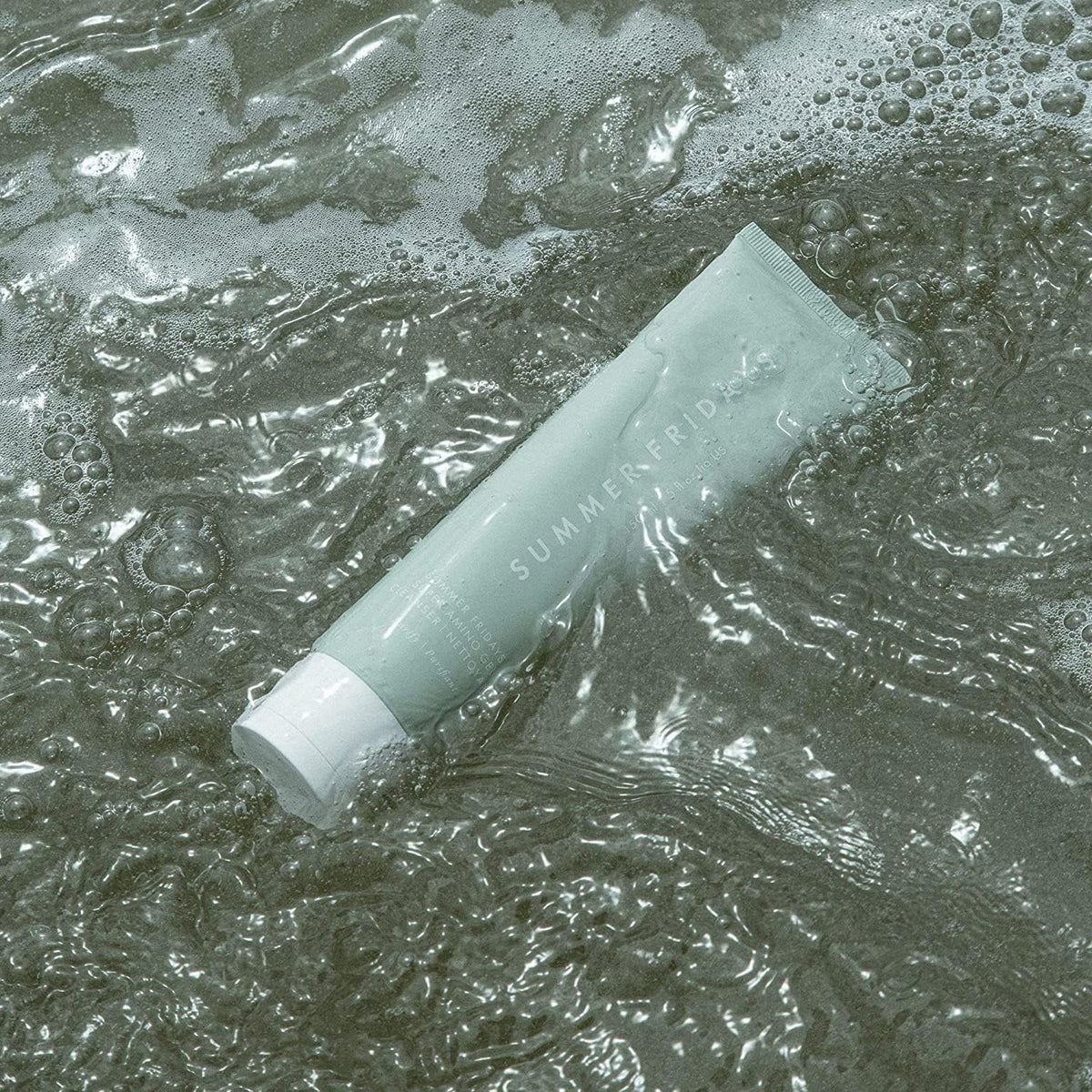 Summer Fridays bottle label detail showing ingredient callouts and nourishing formulation benefit