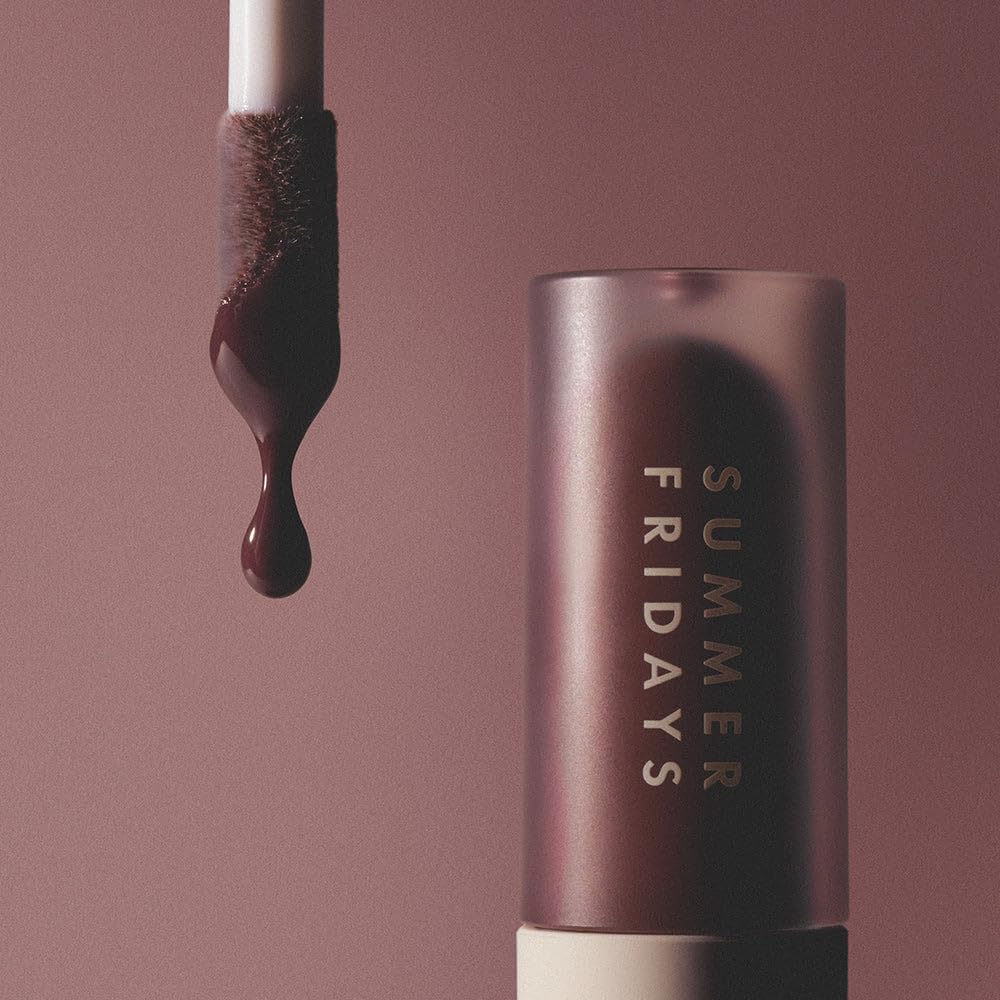 Summer Fridays lip oil held in hand to show compact size and travel-friendly benefit