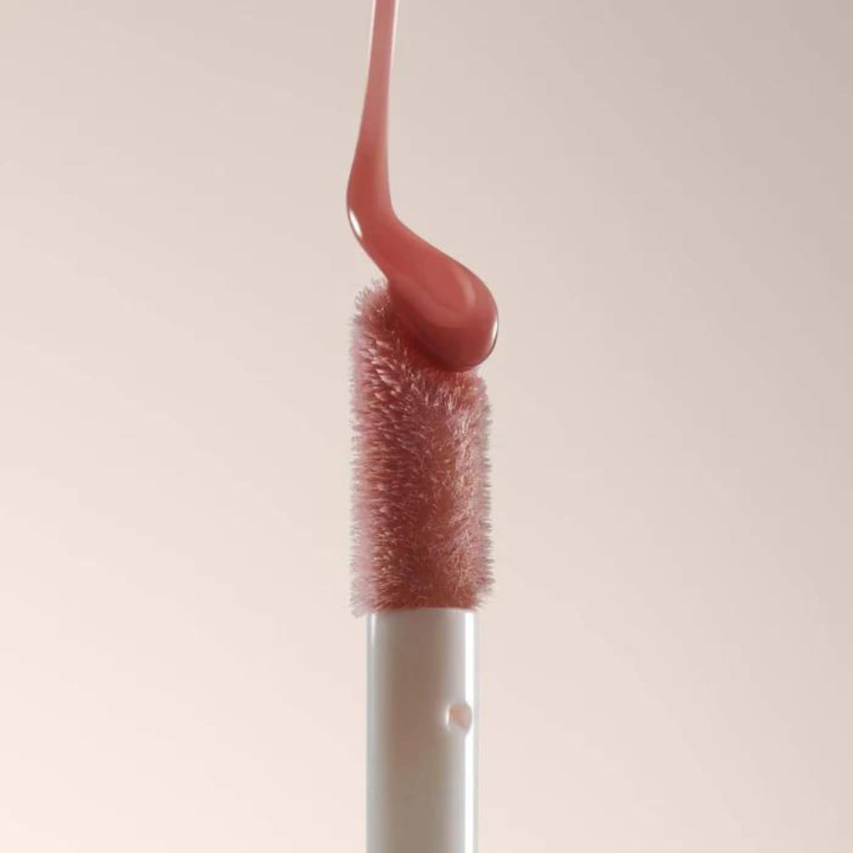 Summer Fridays on lips lifestyle shot demonstrating glossy shine and softening effect