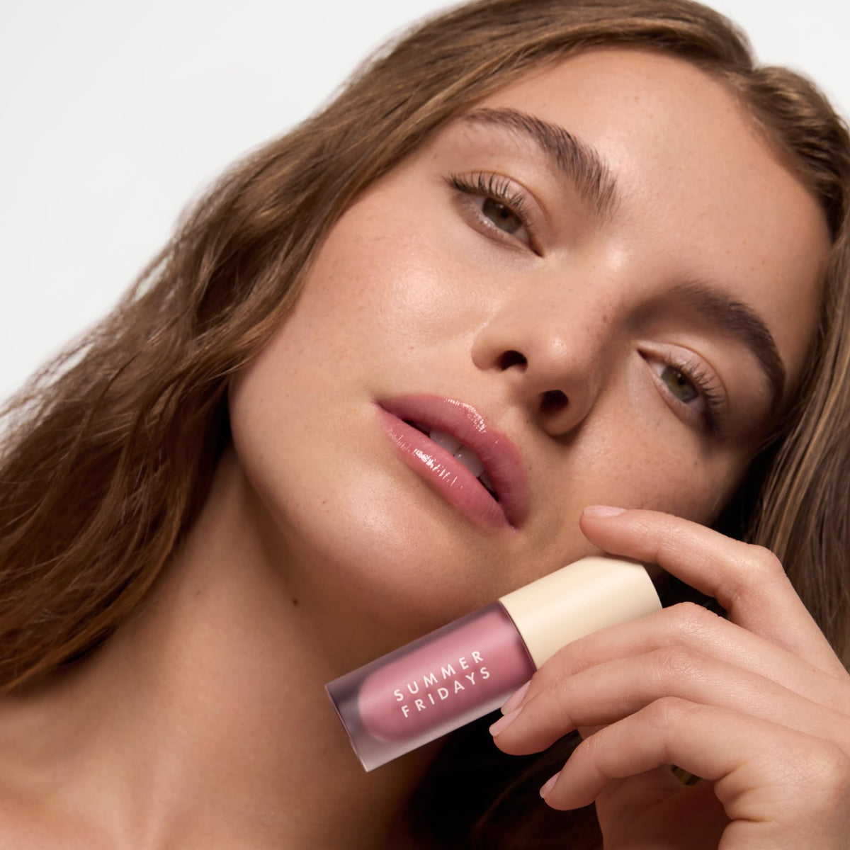 Summer Fridays lip oil texture swirl highlighting non-sticky glossy finish