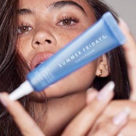 Summer Fridays serum staged in bathroom routine conveying nightly skincare layering benefit