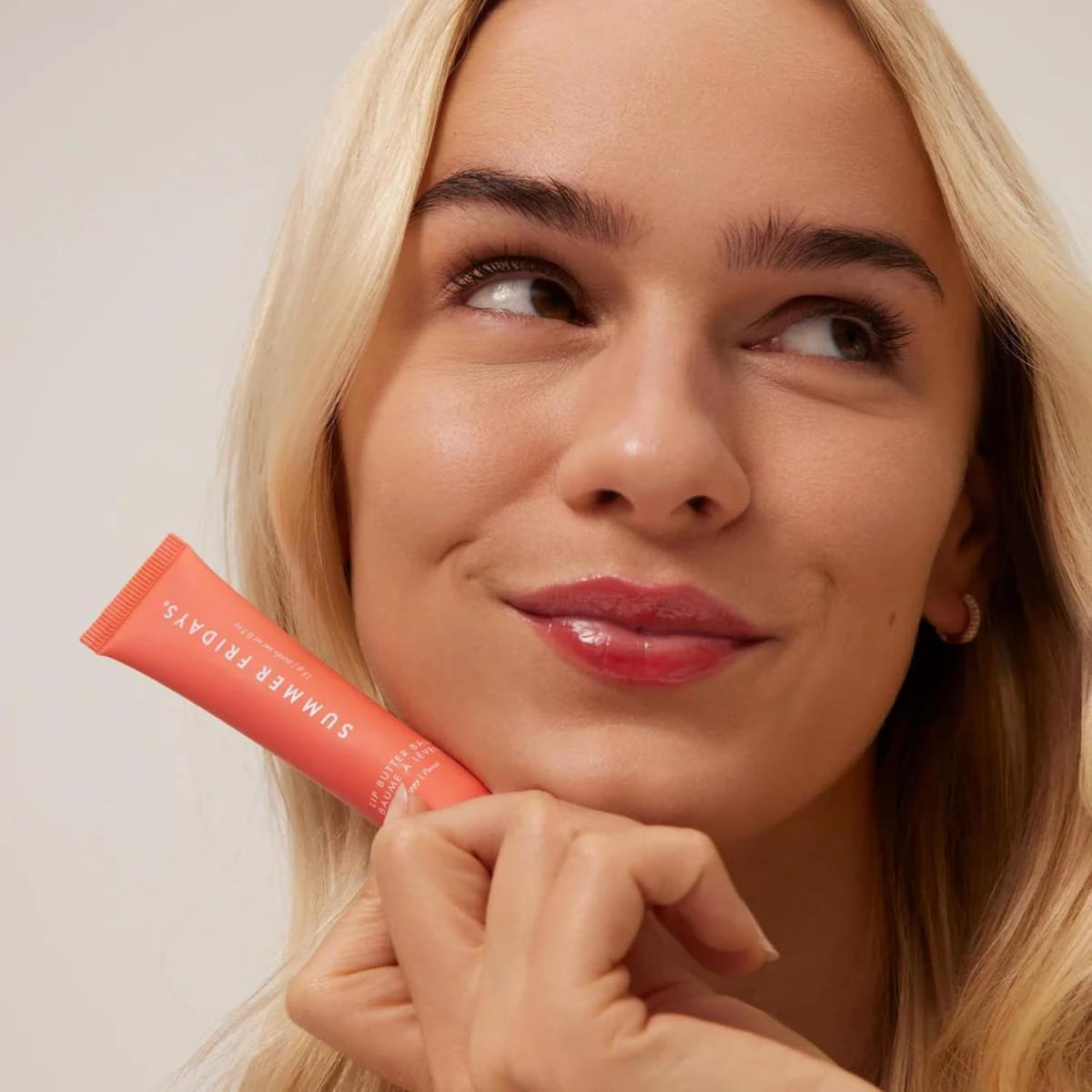 Summer Fridays applied on lips closeup showing sheer color and glossy shine benefit