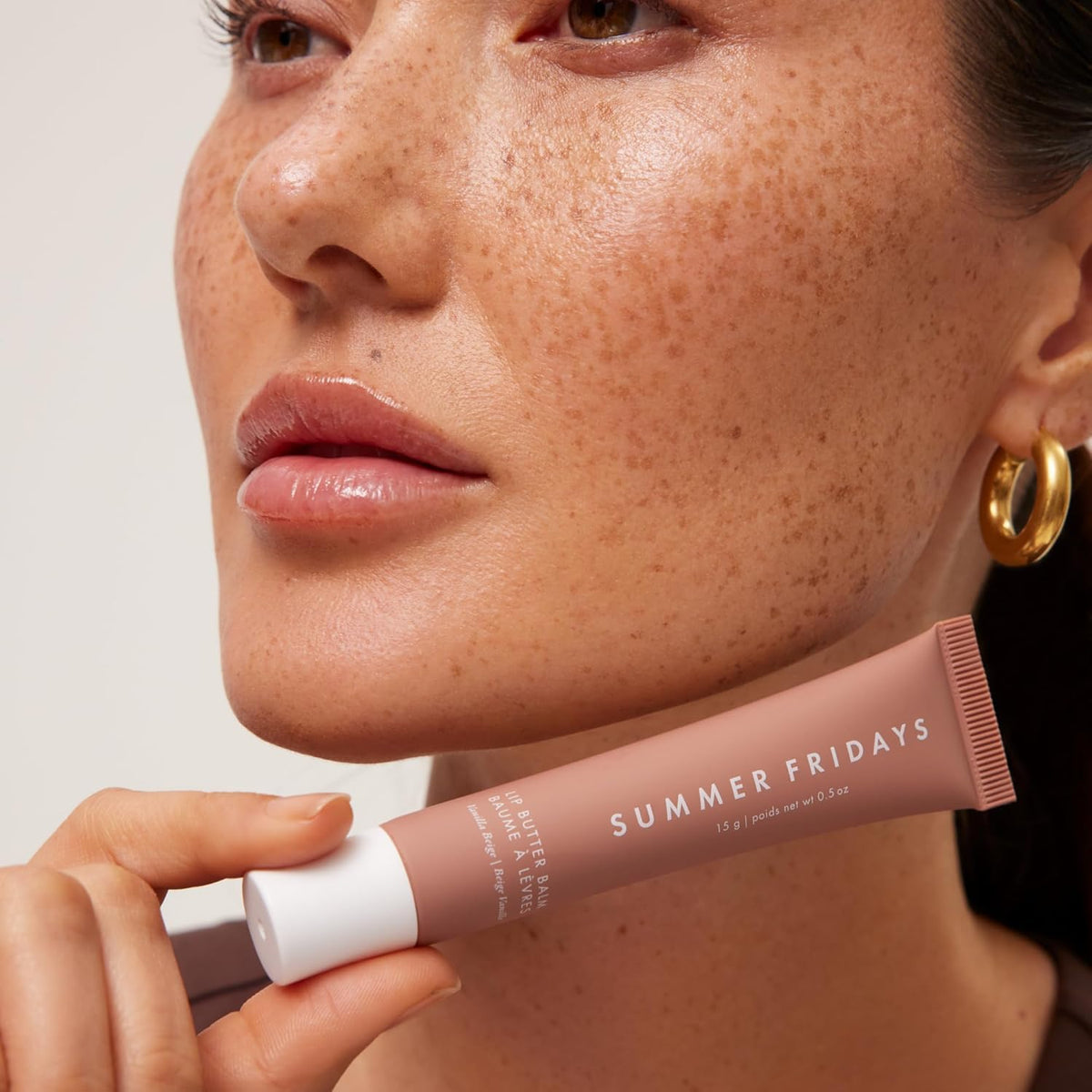 Summer Fridays tube inside a purse for on-the-go hydration and touch-ups