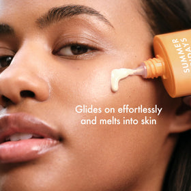 Applying Summer Fridays ShadeDrops on hand to demonstrate easy spreadability