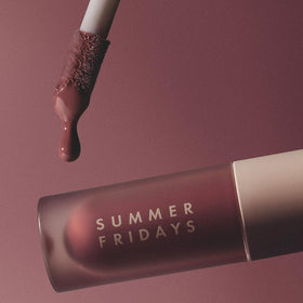 Summer Fridays layered over lipstick adding shine and dimensional color