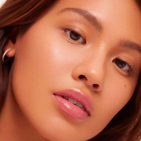 Summer Fridays lip oil tucked in handbag showing everyday convenience