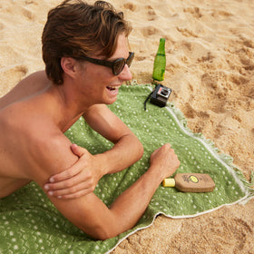 Sun Bum 8 oz bottle label detail highlighting SPF 50, vitamin E, and reef-friendly claims
