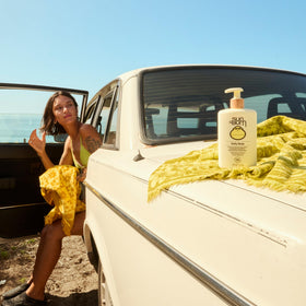 Applying Sun Bum on arm to demonstrate even coverage and quick absorption