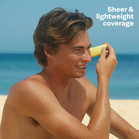 Sun Bum application on cheek demonstrating quick, targeted sun protection