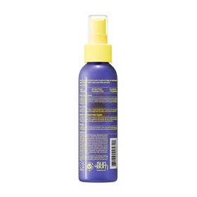 Sun Bum bottle on sandy beach, UV protection and color care outdoors