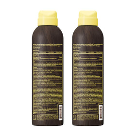 Sun Bum bottle in a beach setting showing portability and reef-safe compliance