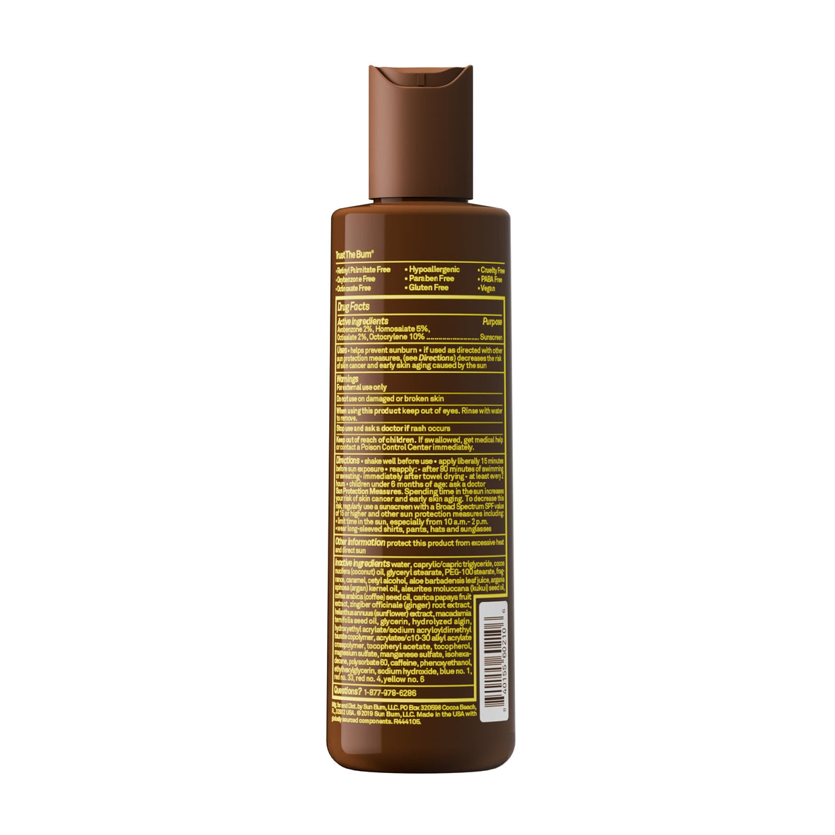 Sun Bum bottle on beach towel showing travel-friendly, reef-safe benefit