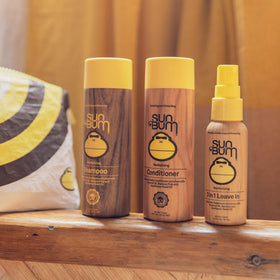 Close up of Sun Bum bottle labels highlighting revitalizing formula details
