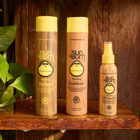 Sun Bum conditioner applied to wet hair demonstrating detangling and easier combing