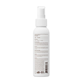 Sun Bum 4 oz detangler held next to hand to show compact size and convenient portability