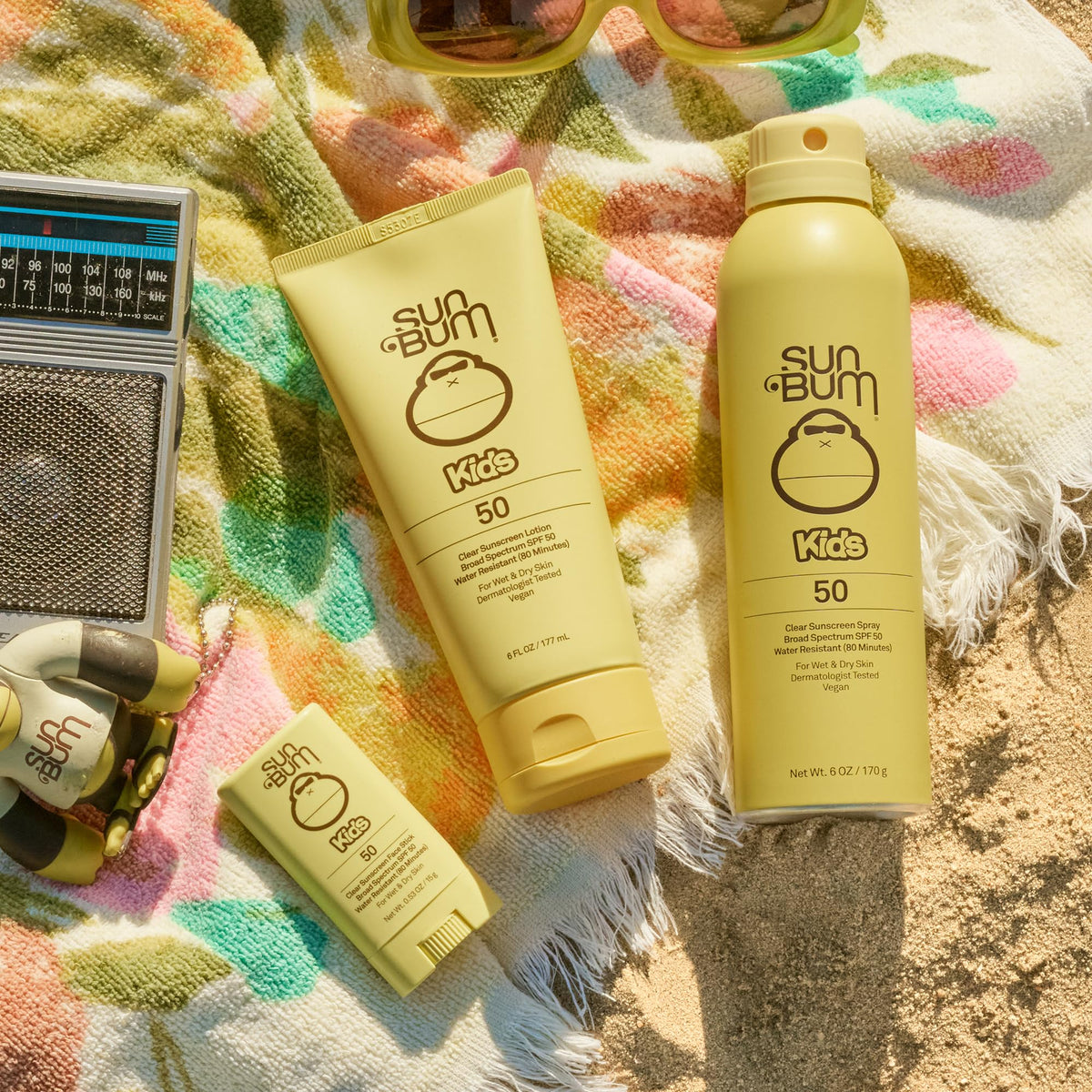 Sun Bum sunscreen being applied on wet skin at poolside to keep kids protected during play