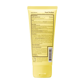 Sun Bum bottle in a family beach scene highlighting water-resistant protection for active kids