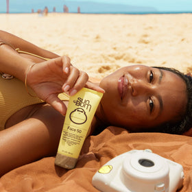 Sun Bum label close-up highlighting SPF 50, Vitamin E, and reef-safe ingredients
