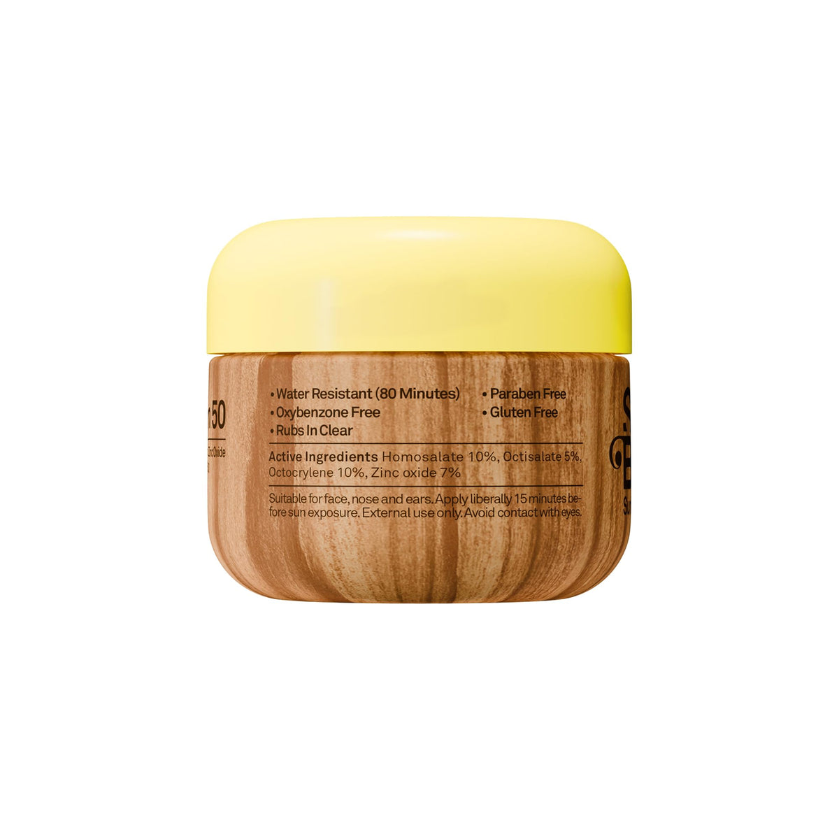 Sun Bum lifestyle beach use with model applying sunscreen for outdoor protection