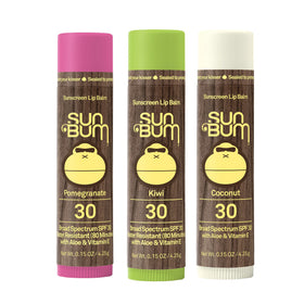 Sun Bum lip balm applied at the beach demonstrating on-the-go UVA/UVB protection