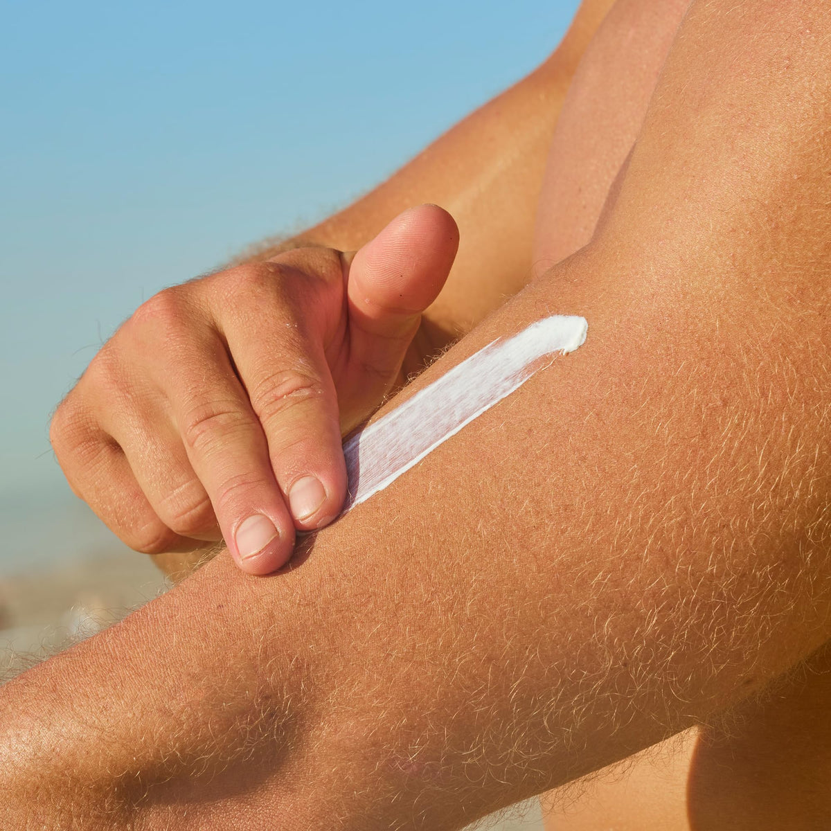 Sun Bum mineral lotion texture pouring to show lightweight spreadability