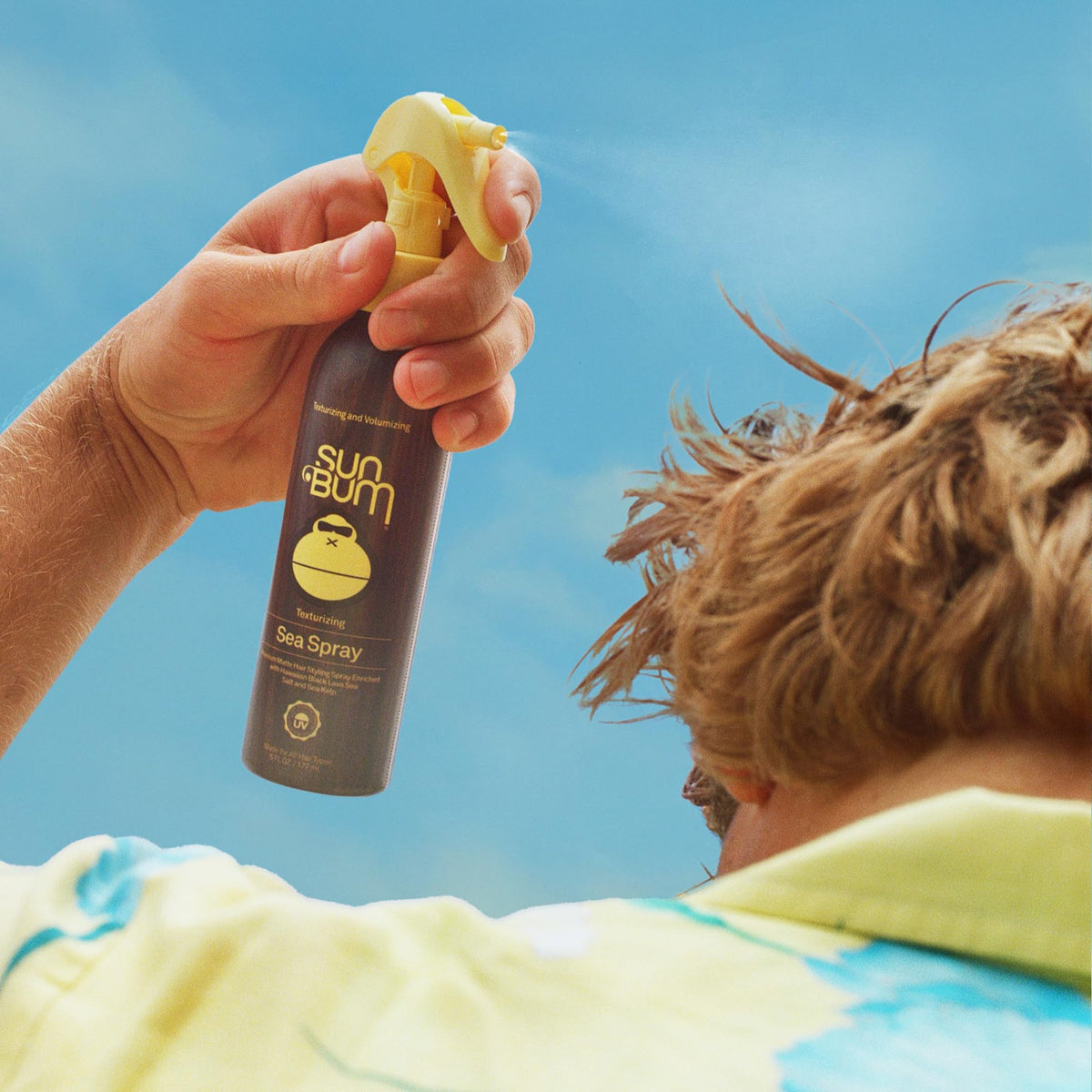 Sun Bum on hair creating textured waves and added volume