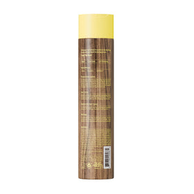 Sun Bum bottle next to beach items showing travel-friendly benefit