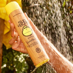 Sun Bum size and scale 10 ounce bottles displayed to show travel-friendly proportions and value