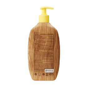 16 oz Sun Bum bottle held in hand to show scale and travel readiness