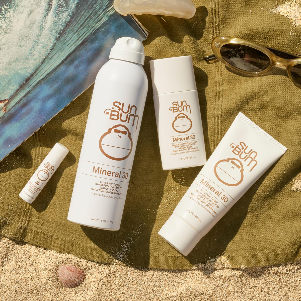 Travel size Sun Bum tube in hand, convenient for carry-on and beach bags
