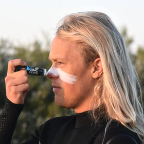 Sun Zapper applied on nose demonstrating visible protection while active