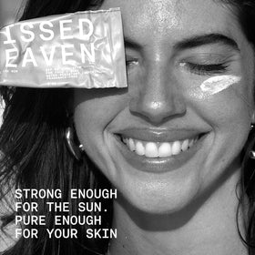 Sunkissed By Heaven jar next to jojoba oil and zinc oxide to show natural components and benefits
