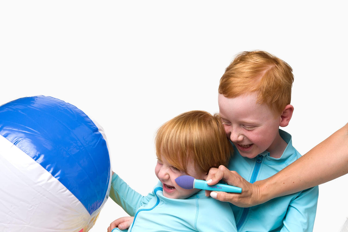 SunnyStik being used at beach with child showing convenience for outdoor days