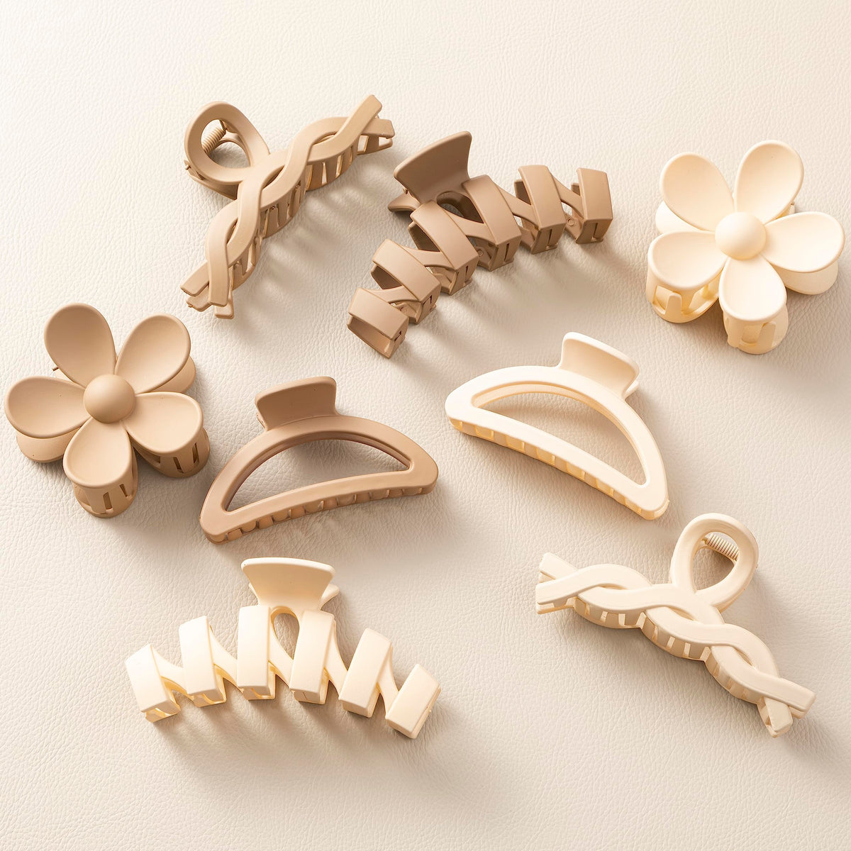 Sunolga front view of eight neutral claw clips showing set and colors, easy styling