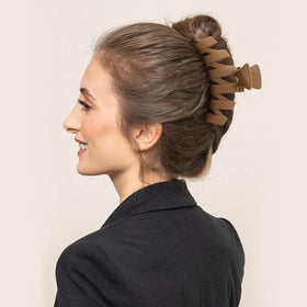 Sunolga clip securing an updo, keeps hair controlled during activities