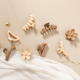 Sunolga clips on bathroom counter near toiletries, tidy styling solution