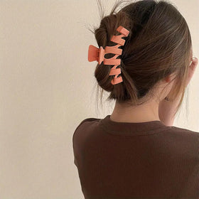 Sunolga lifestyle photo of woman wearing clips for polished look