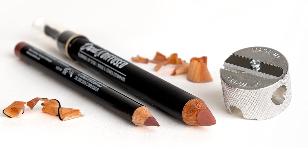 Sun's Out Beauty beside pencils to show compact size and convenient portability