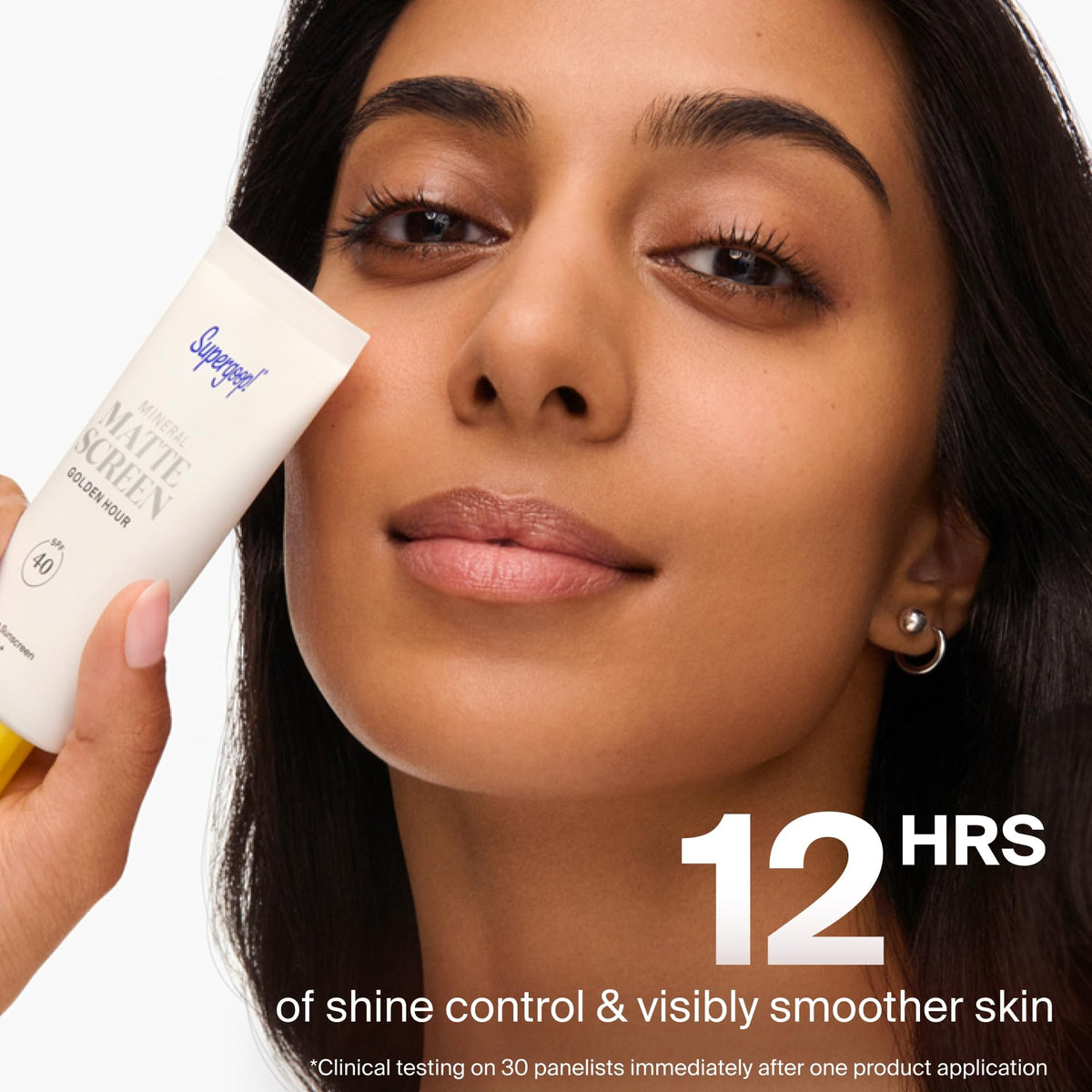 Supergoop! 20 mL tube next to common items showing compact travel size