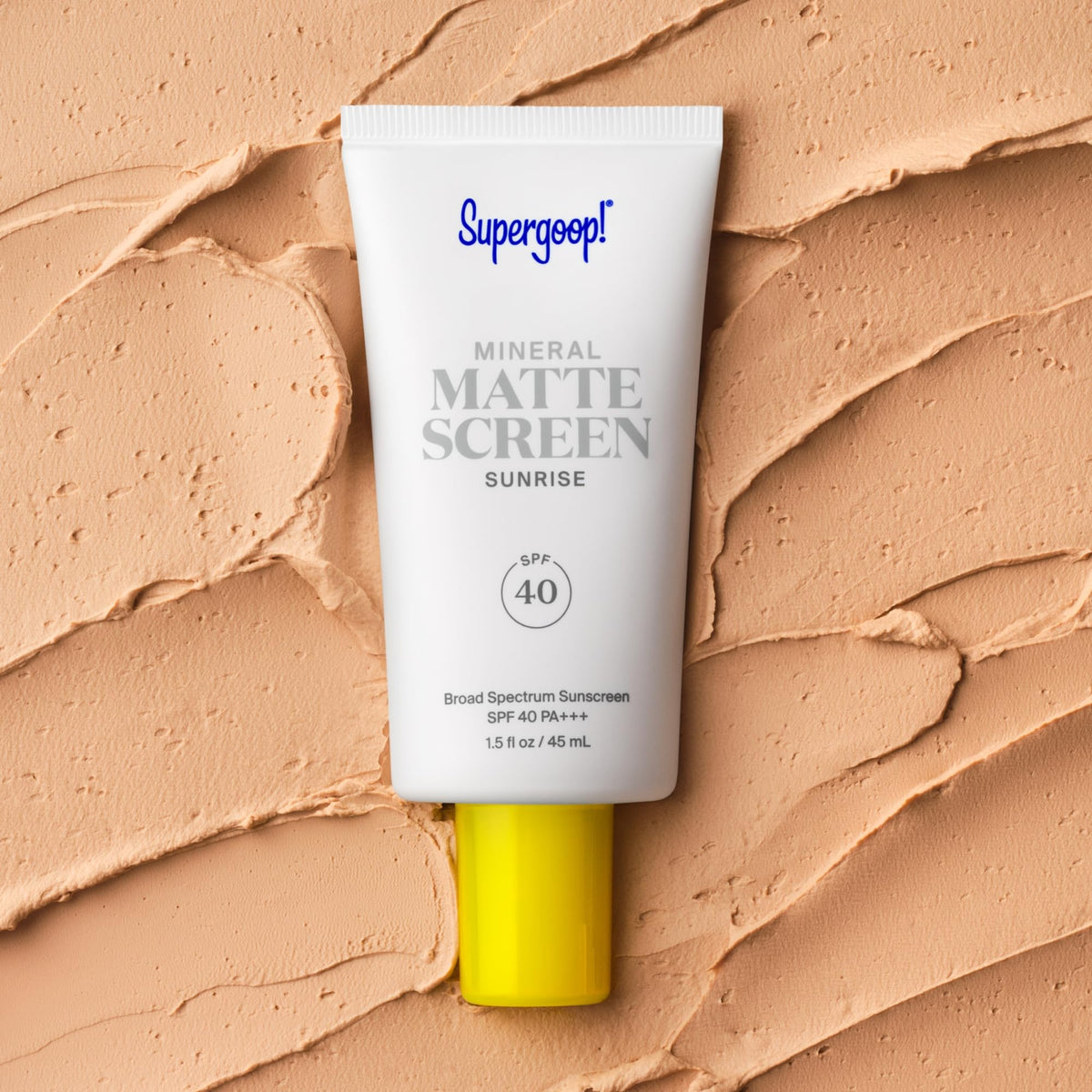Supergoop! applying sunscreen to face showing even coverage and matte look