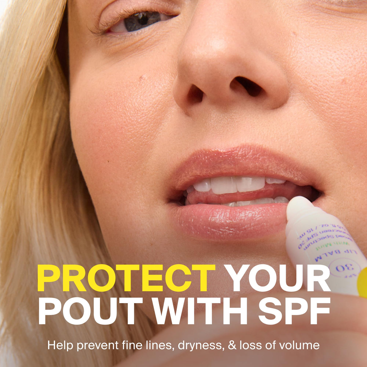 Supergoop! mint lip balm in hand showing travel size and easy pocket‑carry benefit