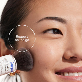 Label and ingredient list on Supergoop! compact highlighting zinc oxide and ceramides