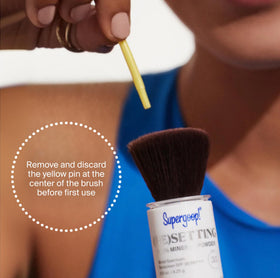 Supergoop! applying powder on model to set makeup and reduce shine