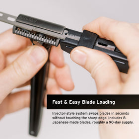SUPPLY blade being loaded into SE razor illustrating fast safe one-handed loading