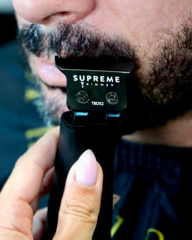 Supreme Trimmer trimming a beard illustrating quiet performance and sensitive-skin comfort