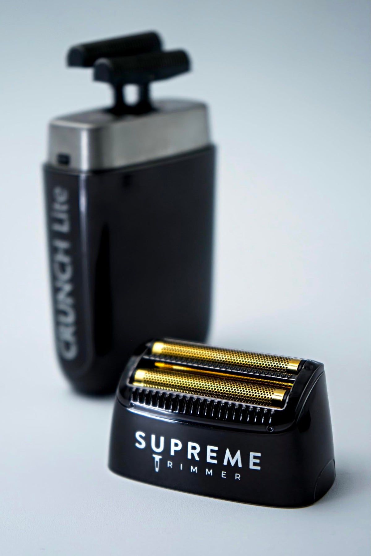 Lifestyle image of Supreme Trimmer SB55 beside sink showing clean shaving setup and comfort benefits