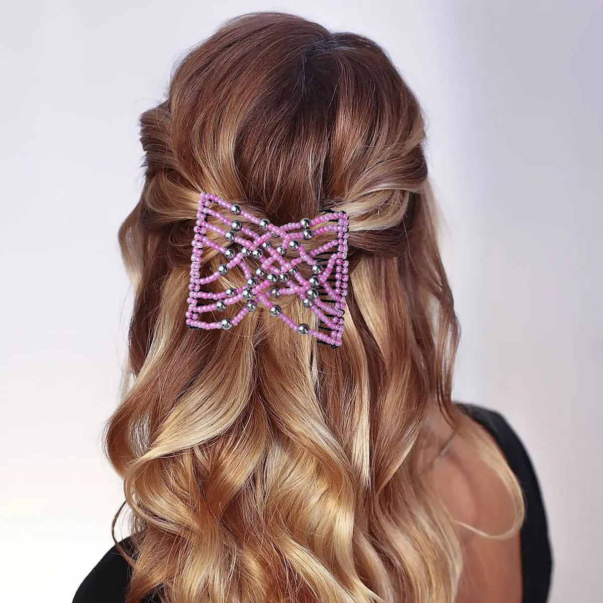 Suptizizkz securing a ponytail on long straight hair demonstrating no-crease finish