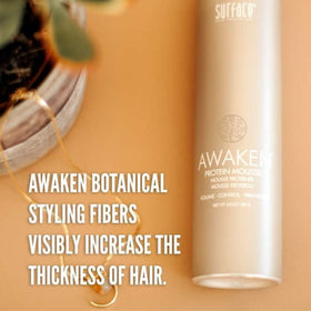 Surface Awaken Mousse 8.8 oz bottle next to ruler showing true size