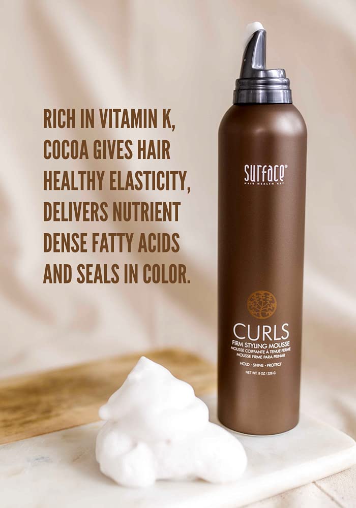 SURFACE Curls Firm Mousse being diffused into curls showing defined bounce