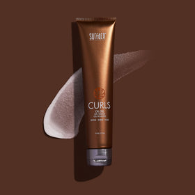 SURFACE gel texture being dispensed highlighting moisturized, shiny curls